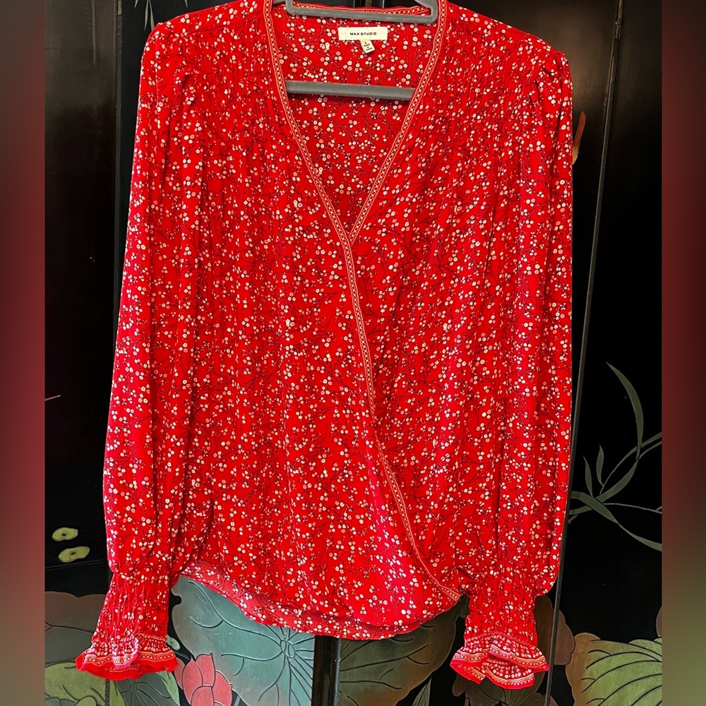 Max Studio blouse for women. Alluring wrap-style front shows off your neckline.